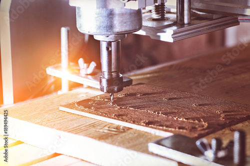 cnc milling machine in work wood