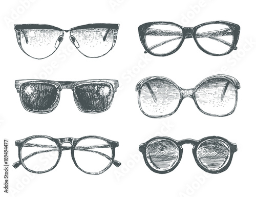 Fototapeta Naklejka Na Ścianę i Meble -  Set of eyeglasses and sunglasses. Fashion vintage elements hand-drawn collection. Engraving style vector lineart  illustration. Retro hipsters style glasses model icons