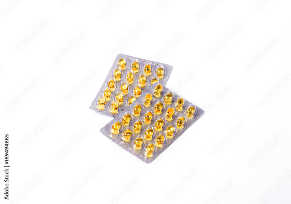yellow capsules pills cod liver oil in packs on white background isolate yellow capsules pills cod liver oil in packs on white background isolate