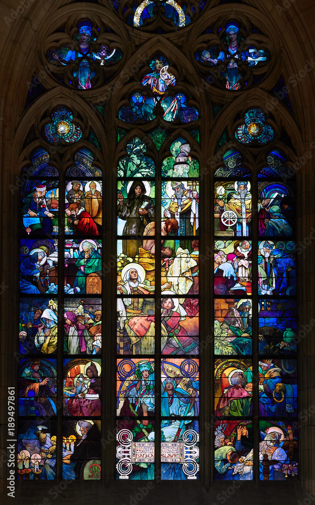Stained glass windows at St Vitus Cathedral interior in the old town of Prague.