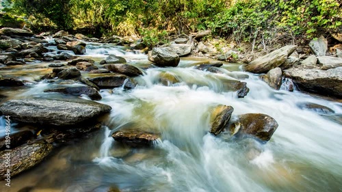 Time lapse of  flowing water  , Maeya  cascade  in chiangmai Thailand photo