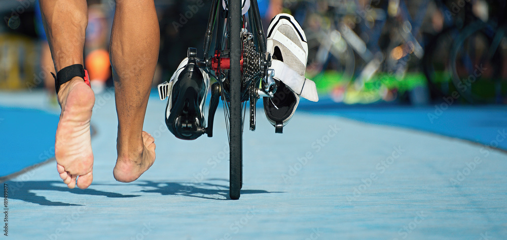 Fototapeta premium Triathlon bike the transition zone,detail of the bare feet
