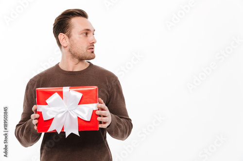 Young man with gift box surprise.