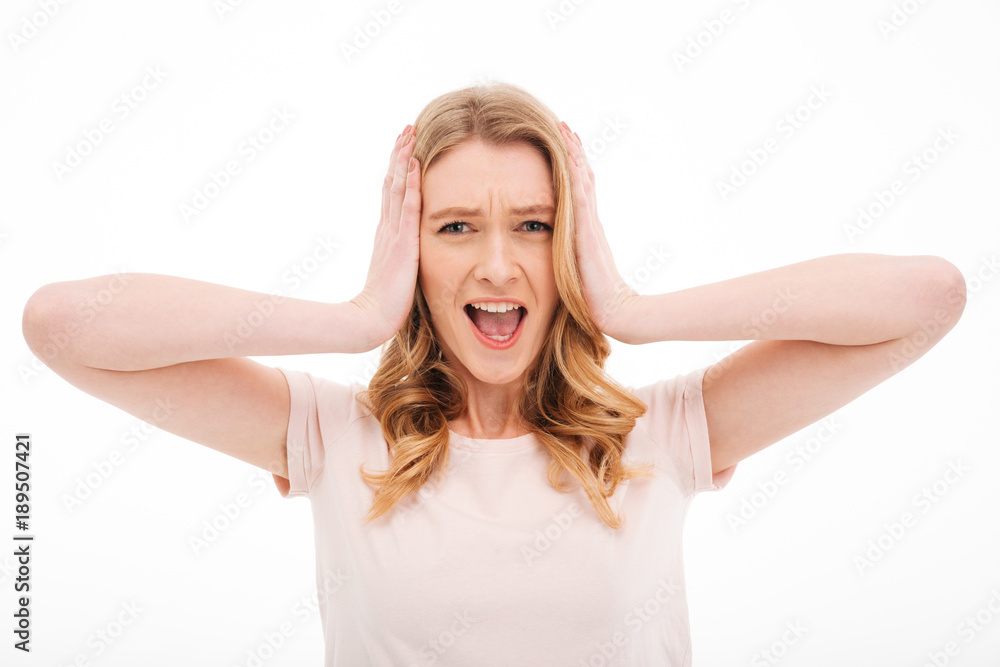 Confused screaming young displeased woman Confused screaming young displeased woman