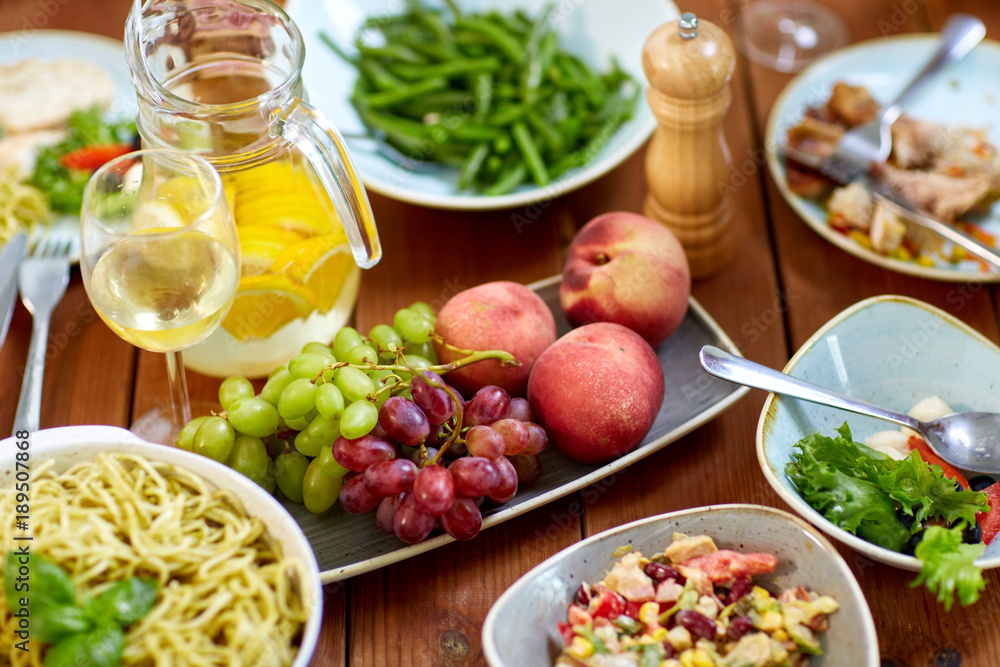 fruits, salads and pasta on wooden table fruits, salads and pasta on wooden table