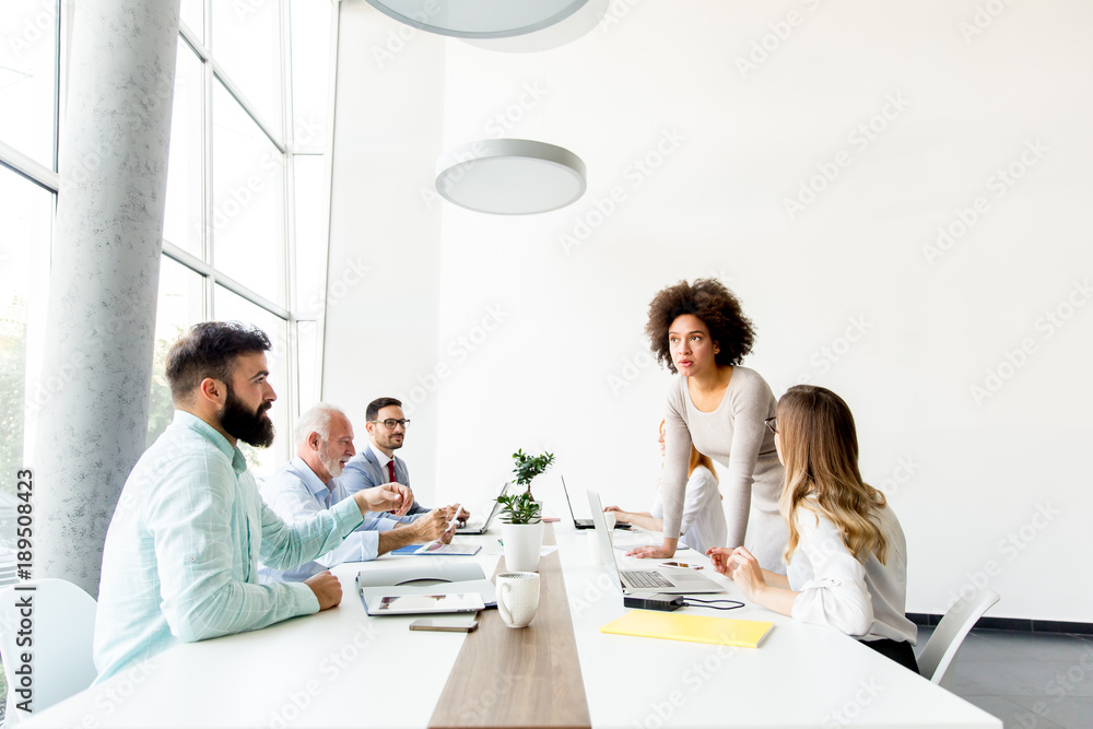 Business people around table during staff meeting