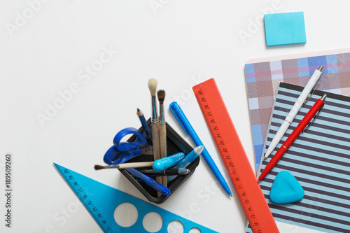 Collection of school supplies on white background photo