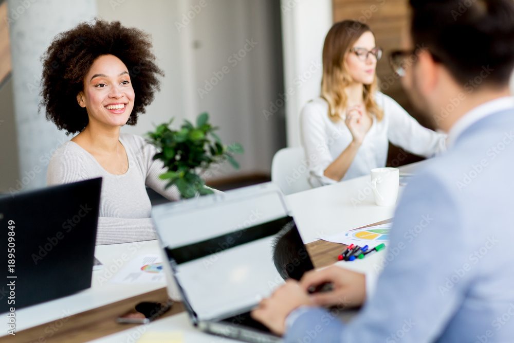 Business people around table during staff meeting Business people around table during staff meeting