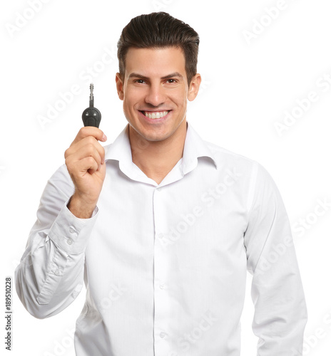 Happy young man with car ke...