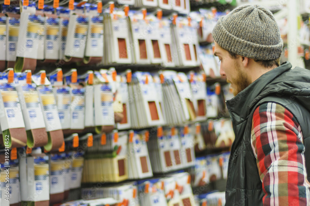 Man in a hardware store Man in a hardware store