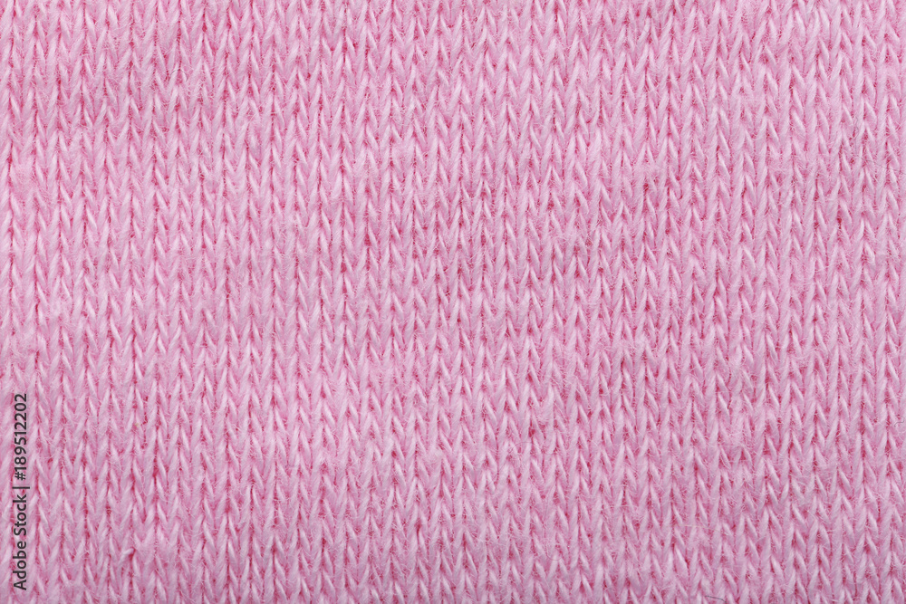 Pink knitted fabric texture as background, closeup Pink knitted fabric texture as background, closeup