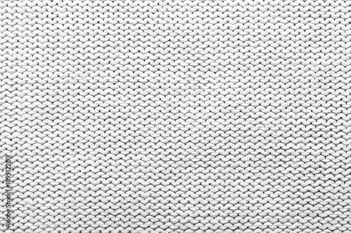 White knitted fabric texture as background, closeup
