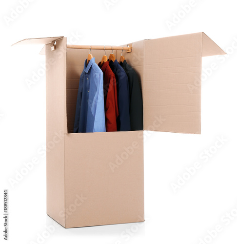 Wardrobe box with clothes on white background