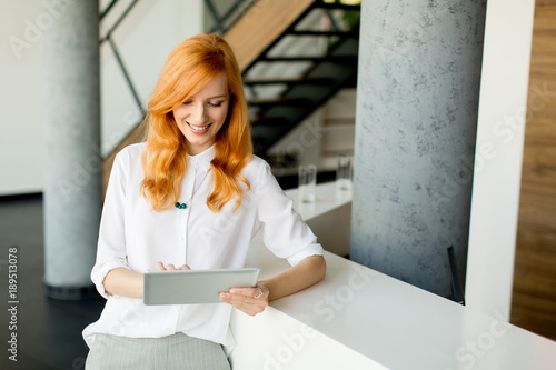 Pretty young red hair woman...
