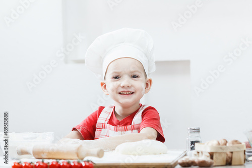 Boy with chef hat preparing...