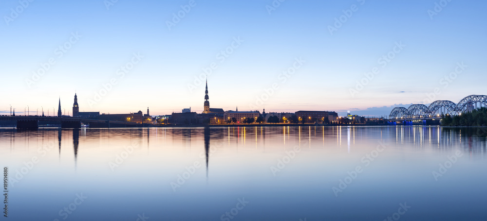 View on Riga cityline panorama in early morning over river Daugava. Panoramic montage from 11 images. View on Riga cityline panorama in early morning over river Daugava. Panoramic montage from 11 images.