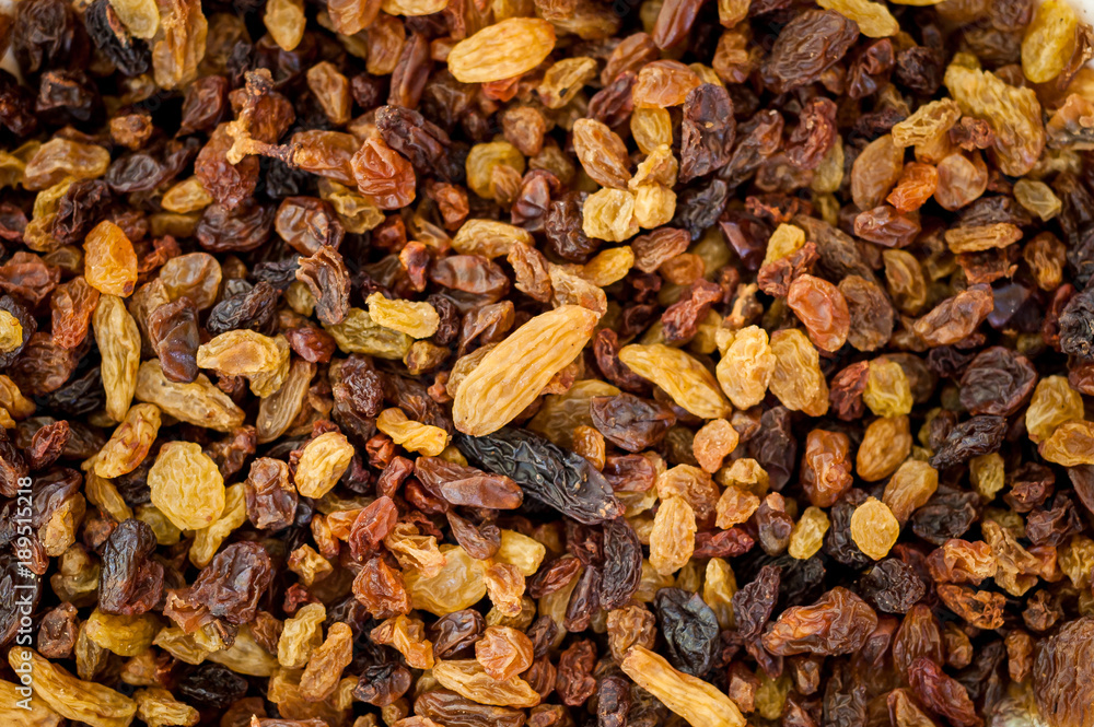 Close-up of yellow and brown raisins. Close-up of yellow and brown raisins.