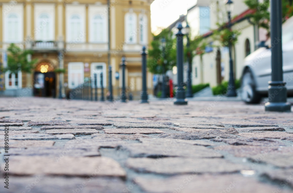 Cobbled square in old european city, blurred background