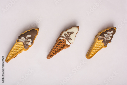 Biscuits with colorful glaze. Sweets in the form of ice cream. Holiday for children. Delicious homemade biscuits. On a white background
