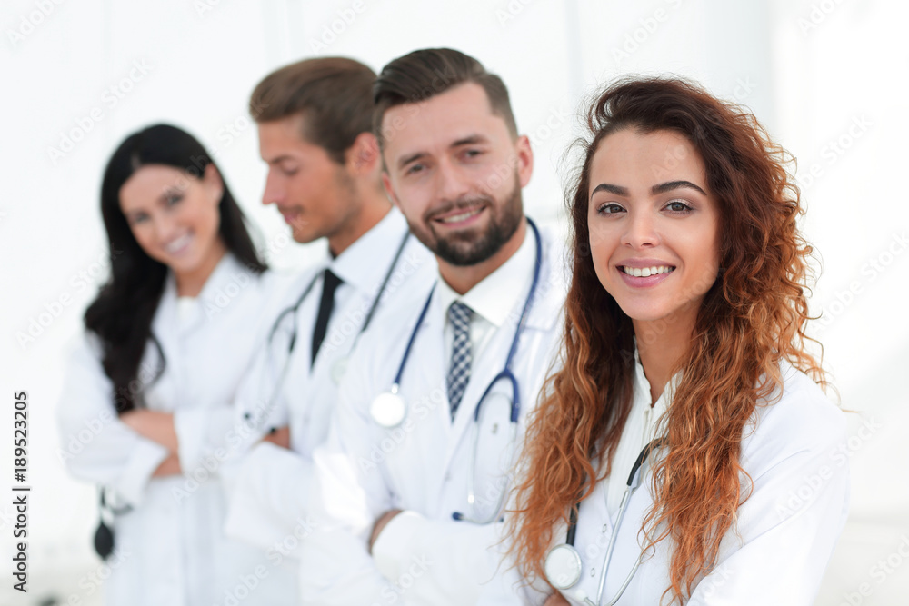 portrait of female doctors with colleagues portrait of female doctors with colleagues