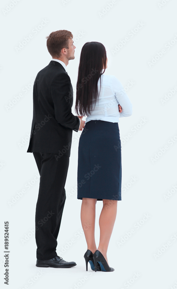 rear view. businessman and business woman standing next to and looking forward. rear view. businessman and business woman standing next to and looking forward.