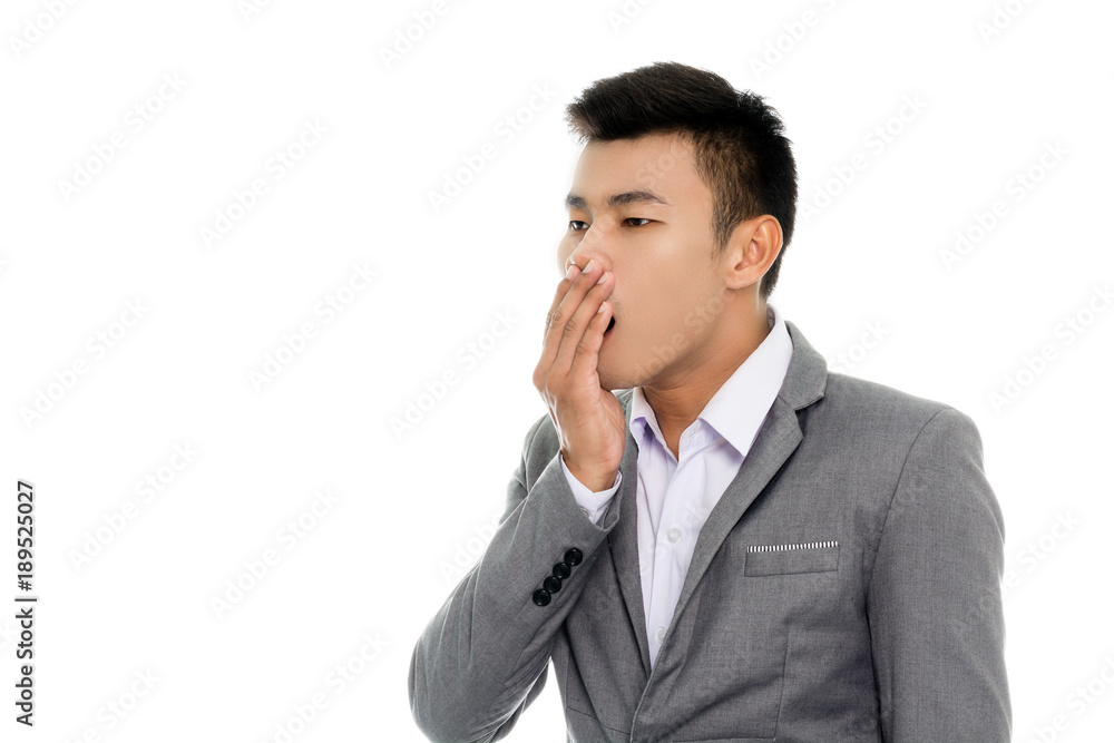 Portrait of a business man is yawning. Isolated on white background Portrait of a business man is yawning. Isolated on white background