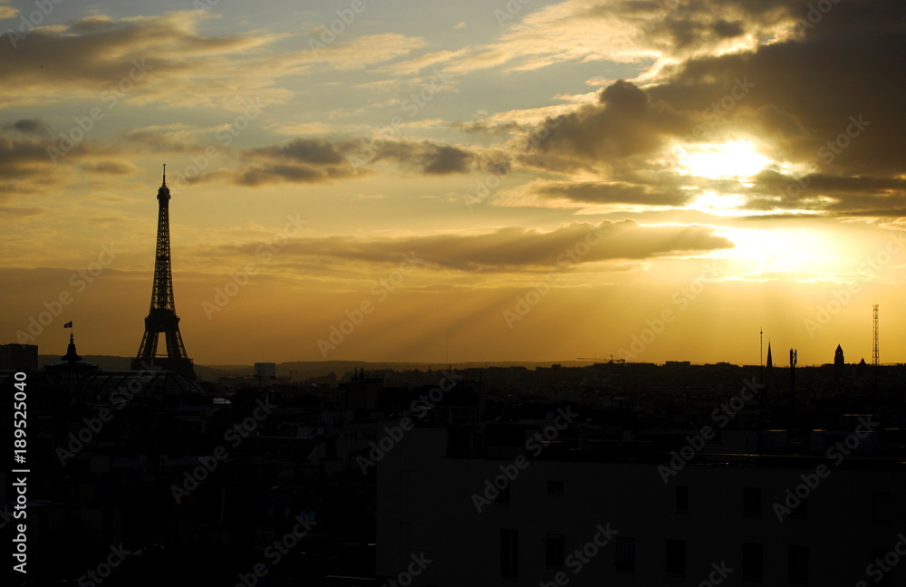 The Eiffel Tower at sunset on the Paris skyline