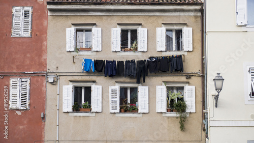 Laundery hanging on a line at a vinatge builing