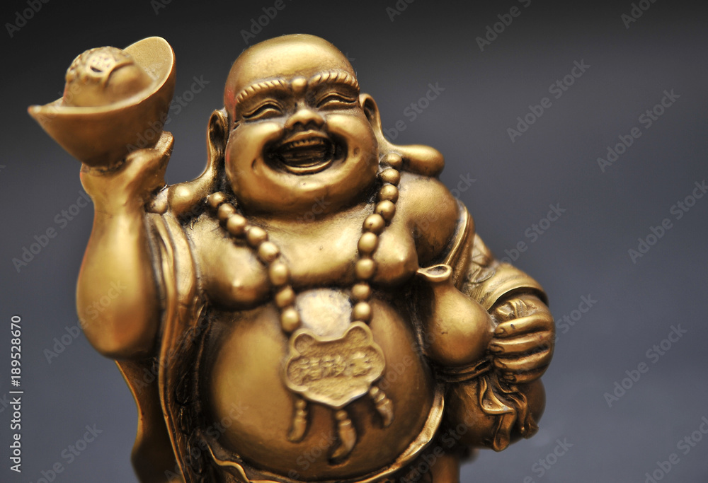 Golden Buddha on a black background Golden Buddha on a black background