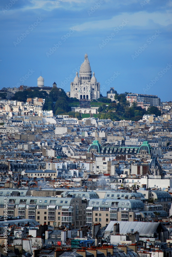 A breath taking view of the Sacre Coeur in the distance on a hill overlooking Paris