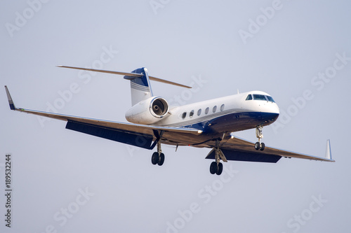 Small private business jet landing at the airport
