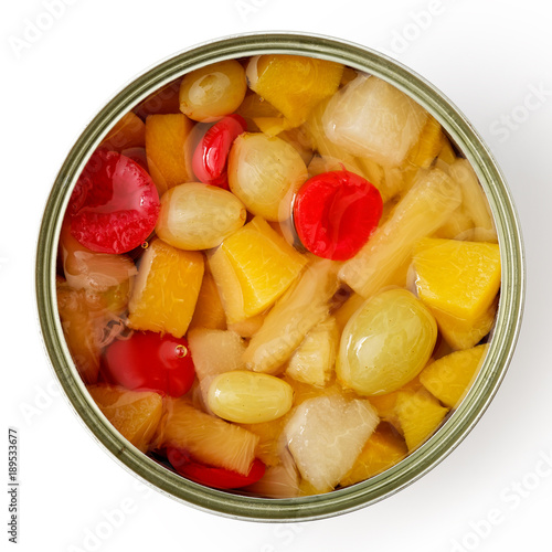 Open can of fruit cocktail isolated on white from above.