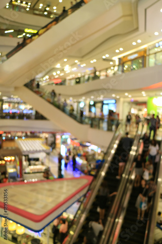Wallpaper Mural Vertical photo of abstract blurred shopping mall with so many people on the escalators  Torontodigital.ca