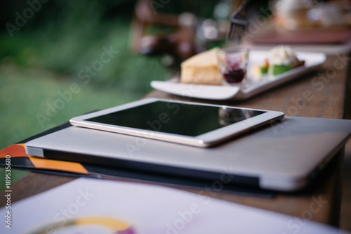 Notebook and tablet with food