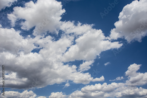 Blue sky with white and gray clouds.