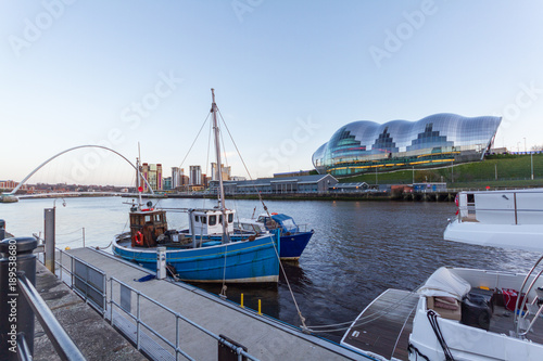 Newcastle Quayside with Sage, Gateshead Millenium Bridge and Boat photo