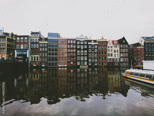 The city of Amsterdam, colorful houses that stand above the water