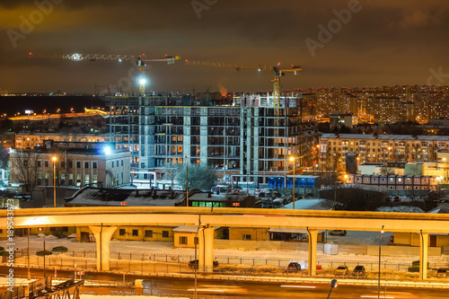 Night scenic view on building construction in the city.