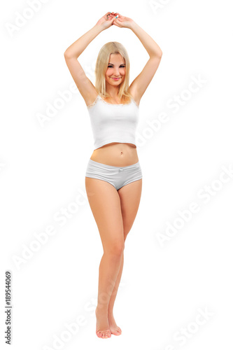 cute natural girl in a white t-shirt and shorts with a raised hand. the concept of hair removal