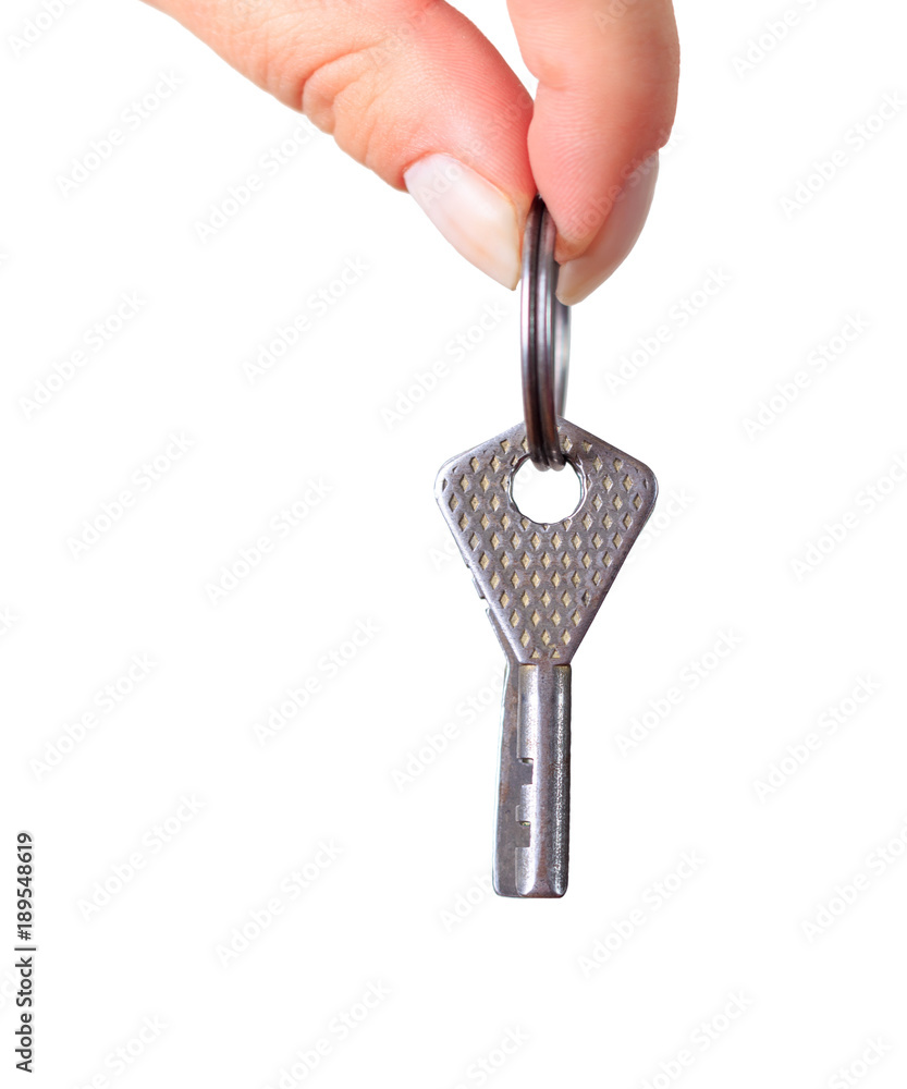 female hand holding metal silver key on white background female hand holding metal silver key on white background
