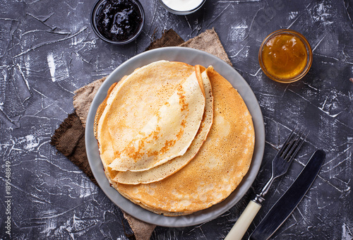 Pancakes crepes with different jam and cream photo