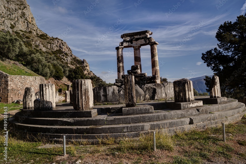 Ruins of Athina Pronaia temple in Ancient Delphi archeological site in Fokida, Greece