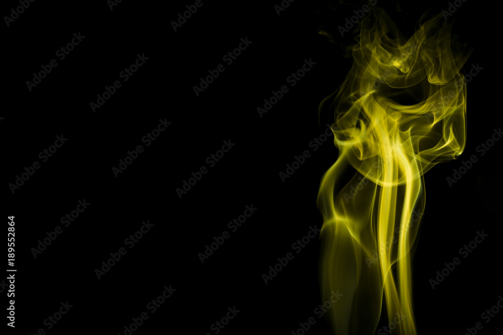 Yellow smoke on black background Yellow smoke on black background