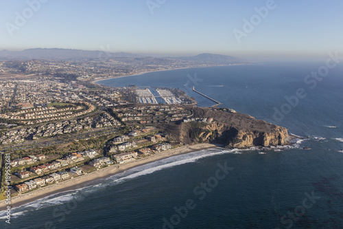 Aerial view of Dana Point shoreline and homes in Orange County California.
