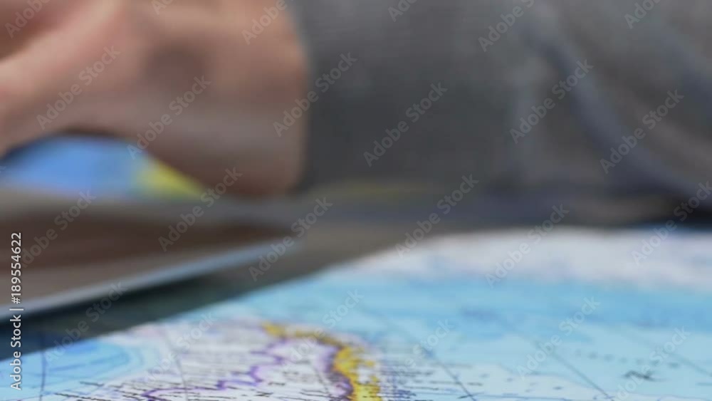 Man booking online safari tour, photo-hunting with vintage camera, close-up Man booking online safari tour, photo-hunting with vintage camera, close-up