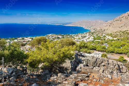 View of coastline near village of Pefkos from monastery on hilltop (Rhodes, Greece) photo