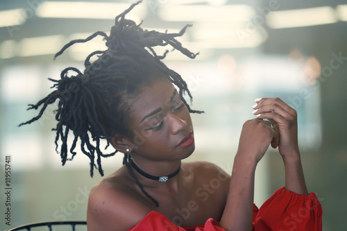 Photography Black female looking at hands
