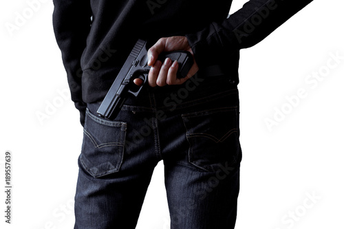 Robber or gangster,thief holding gun in hand hide weapon for killed and shoot on white isolated background