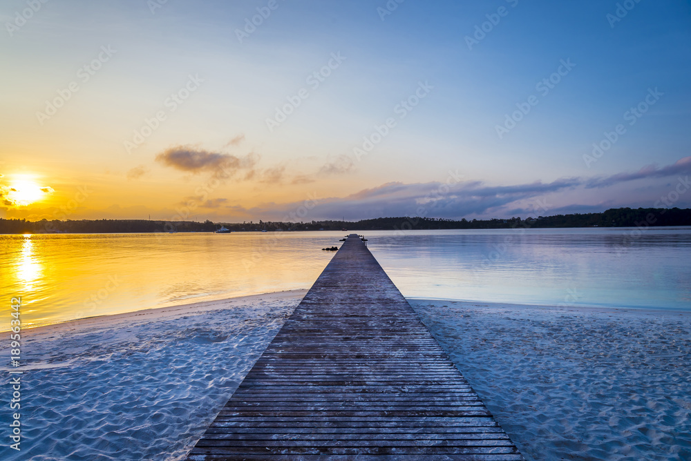 The wooden bridge long to the sea with twilight sky background at KohKham , Trad,Thailand