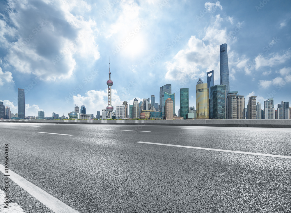 Fototapeta premium cityscape and skyline of shanghai from empty asphalt road.